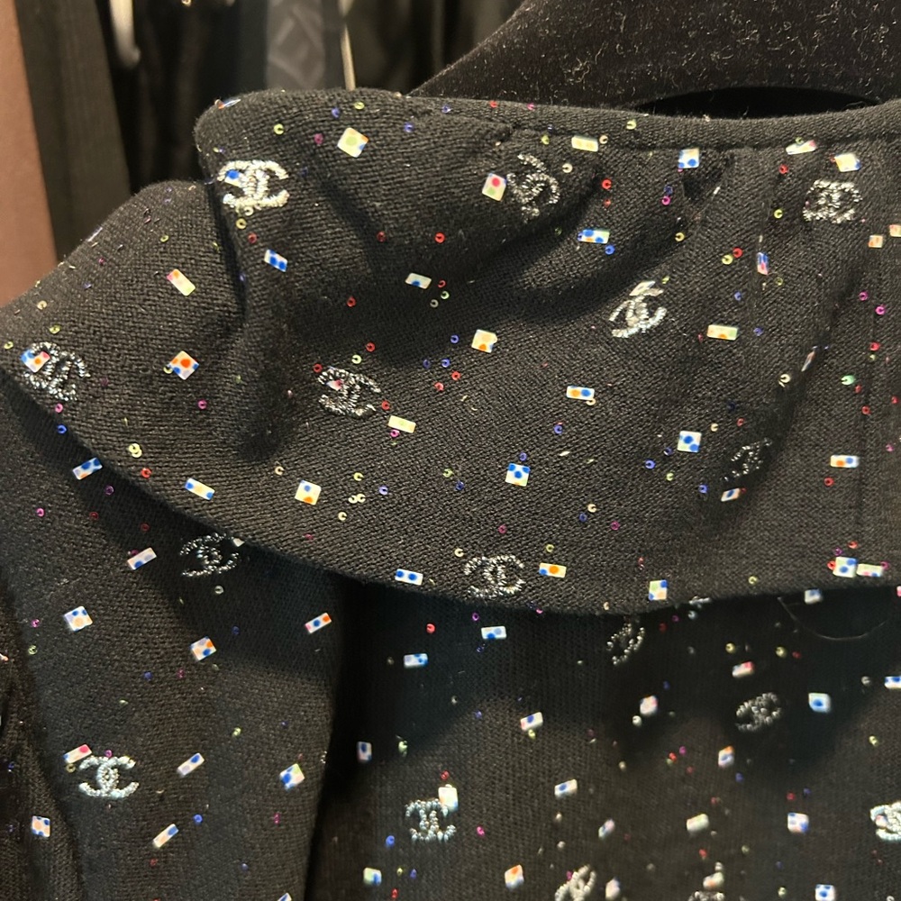 CHANEL black long sleeve top with embroidered sequins.